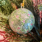 Silver papier-mache Christmas bauble hand-painted with leaves and berries
