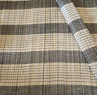 A natural bamboo placemat or table mat with black thread