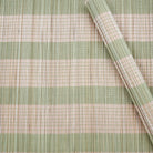A Bamboo placemat with lime green stripes