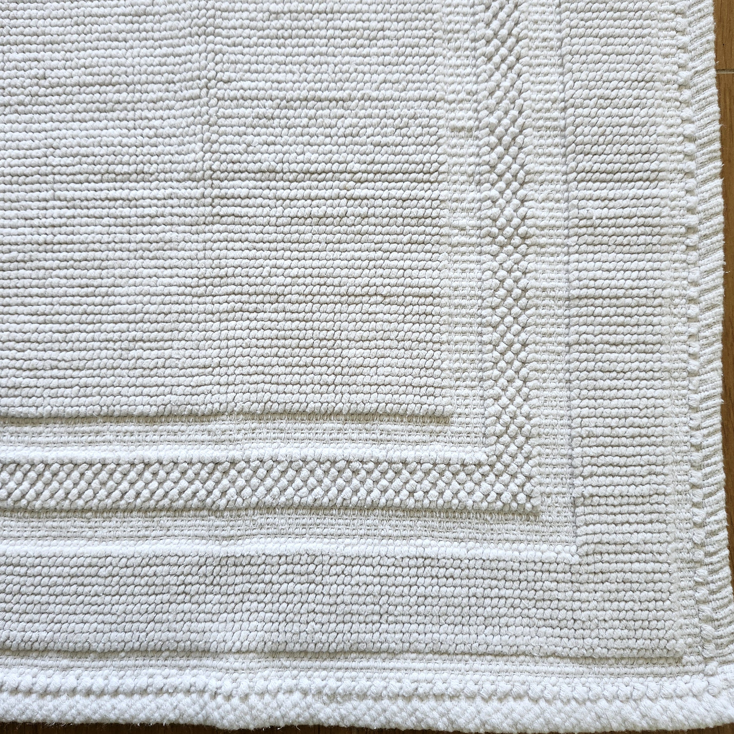 White woven cotton bath mat, soft looped weave, 100% stonewashed cotton