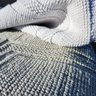 Woven cotton bath mats in white and taupe, looped weave, 100% cotton
