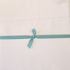 White Egyptian cotton flat sheet, 310 thread count percale, styled on a bed