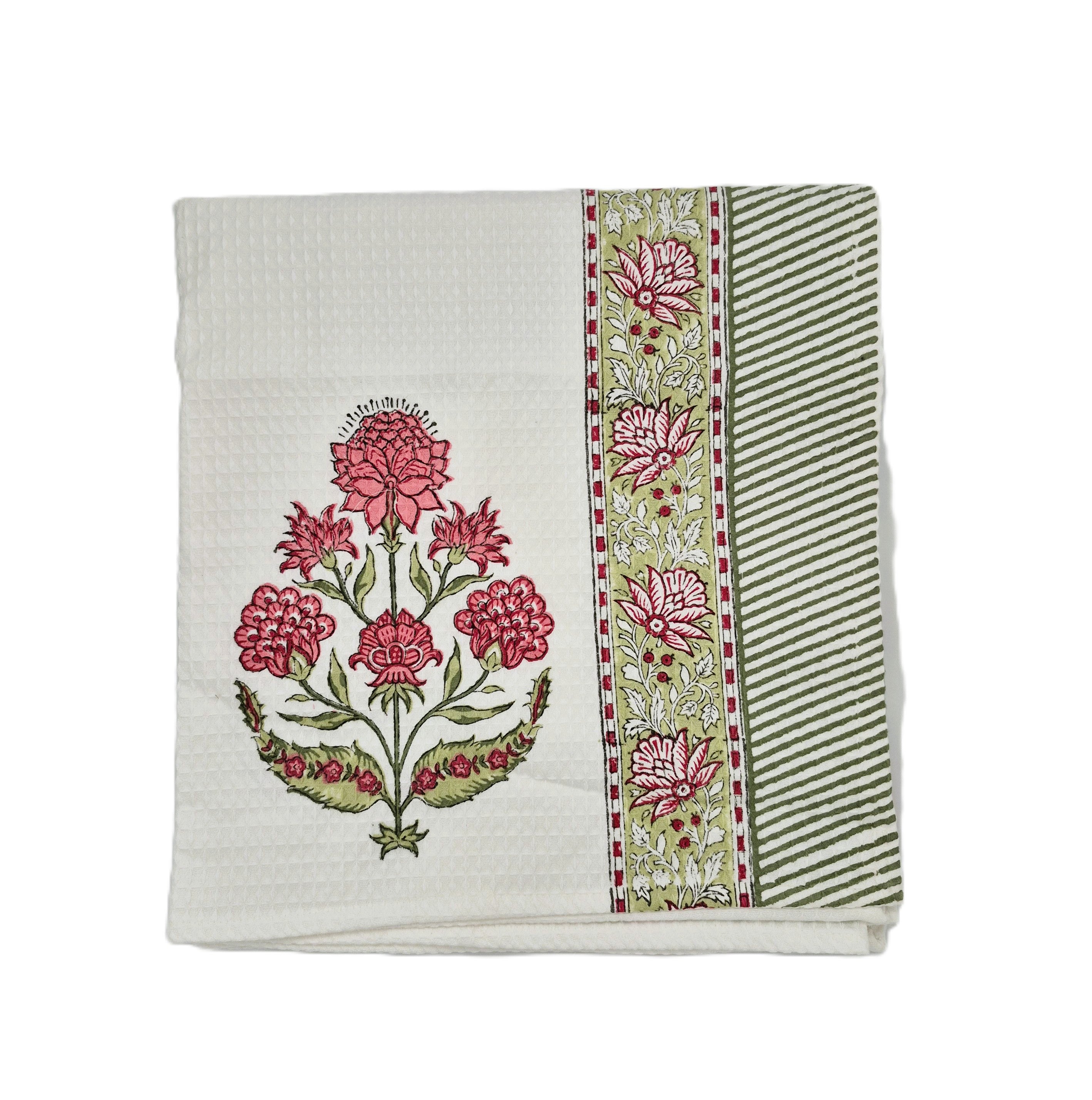 Block Print waffle towel with floral design and a striped border on a white background