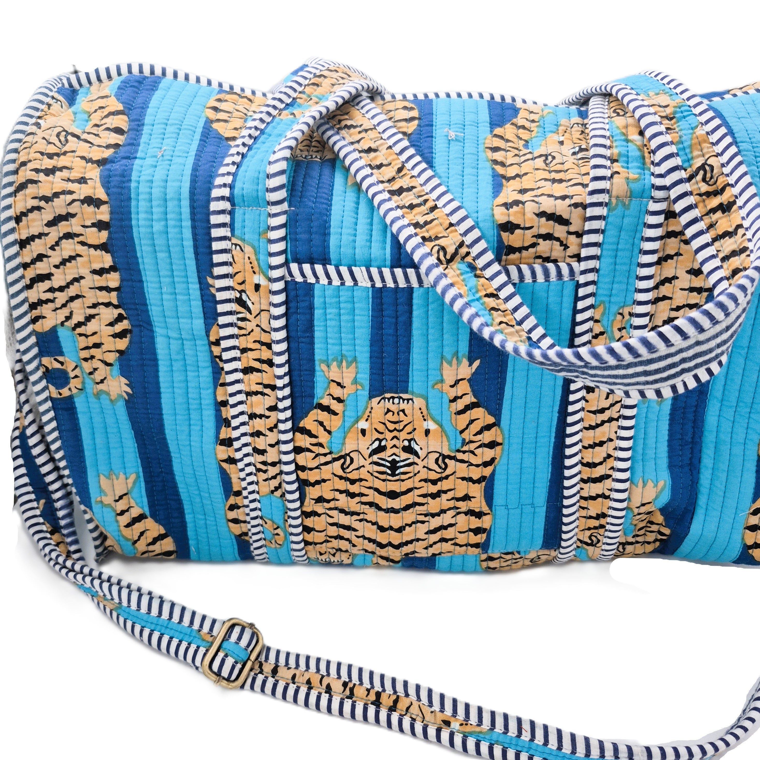 Quilted block-print weekend bag in a blue tiger print