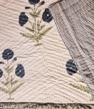 King block-print quilt with a blue poppy pattern on off-white