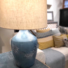 Blue-glazed terracotta lamp with a leaf motif and shade