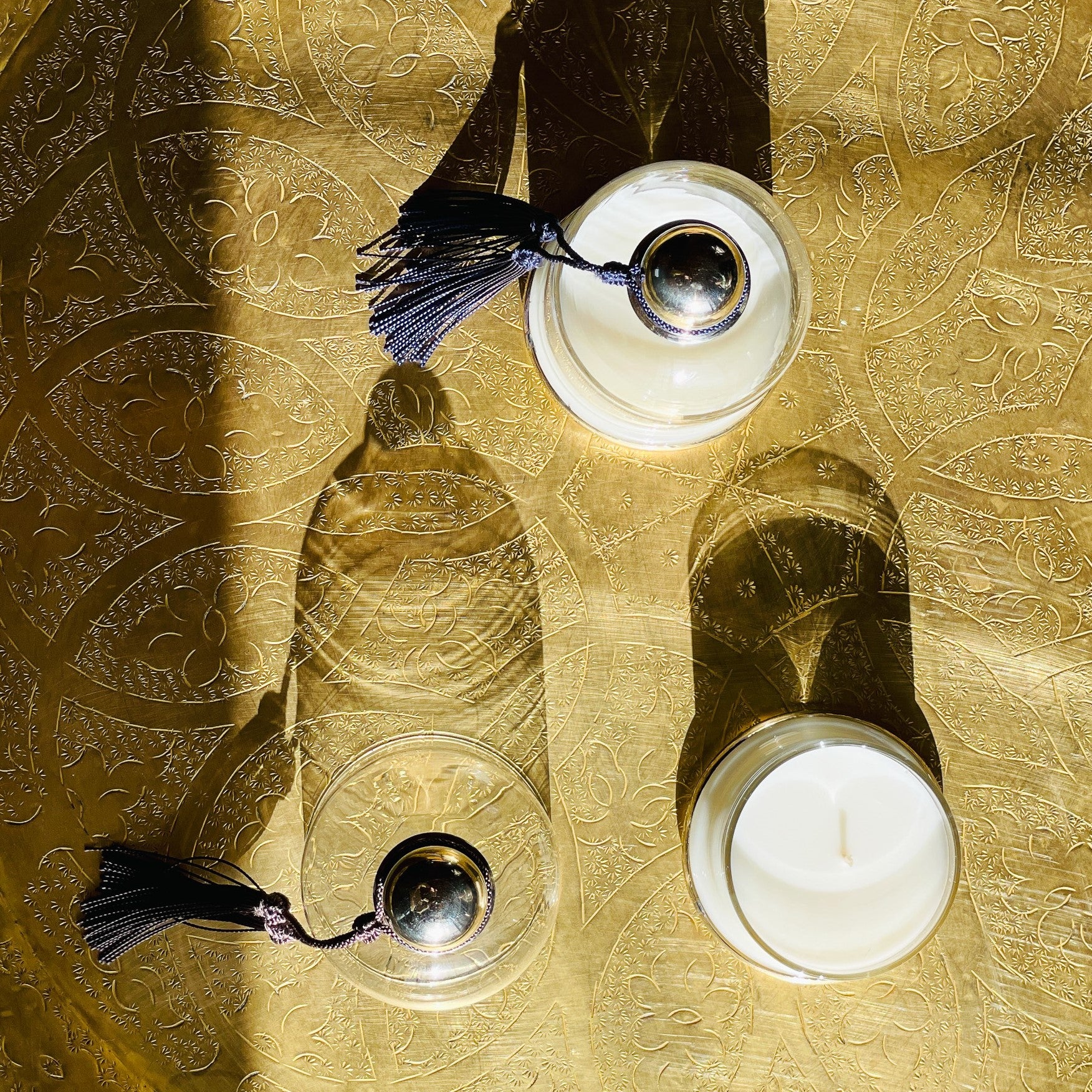 Cloche Verveine candle styled in a room setting, glass cloche and silver base
