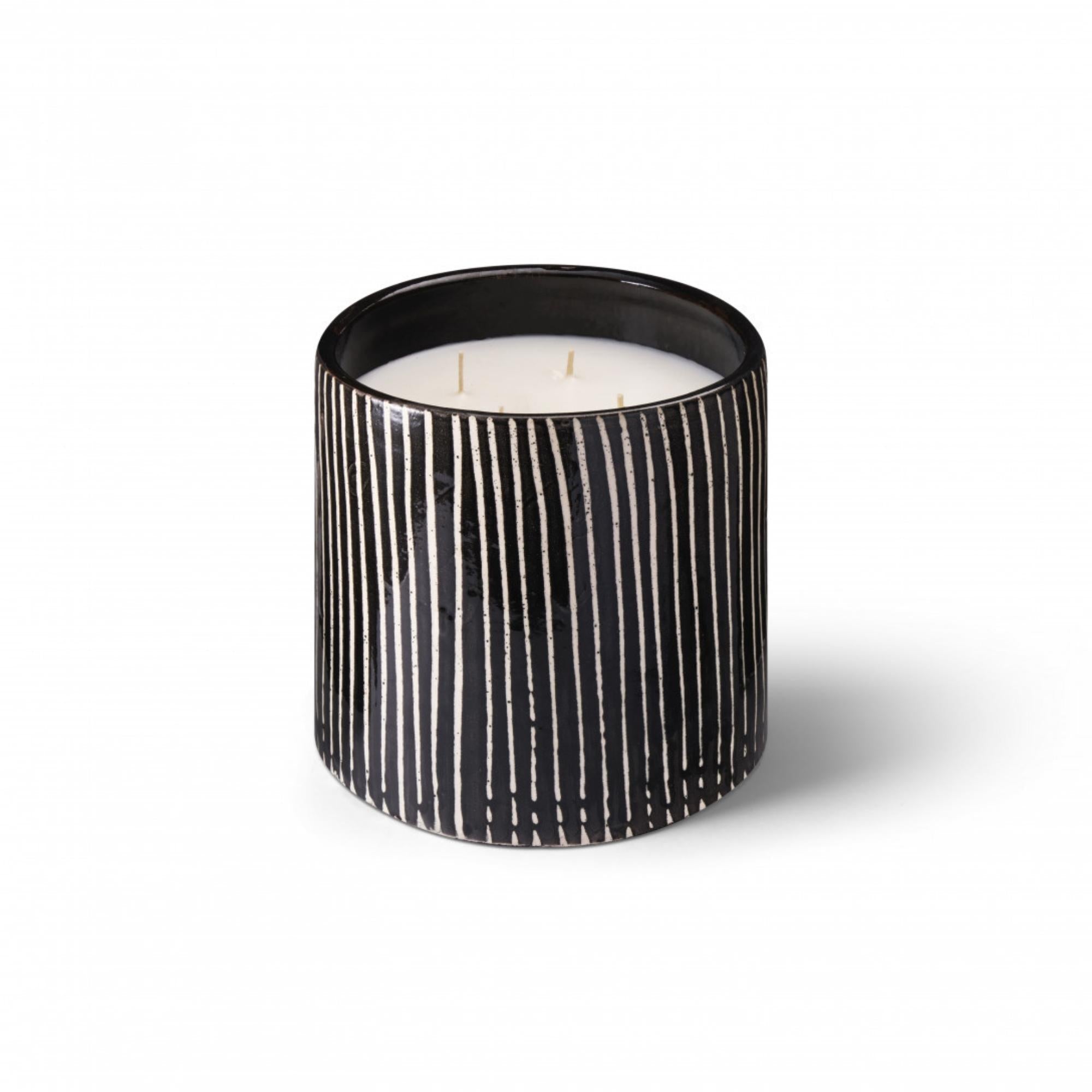 Zebra Mandarin Majorelle candle, striped ceramic pot, styled view