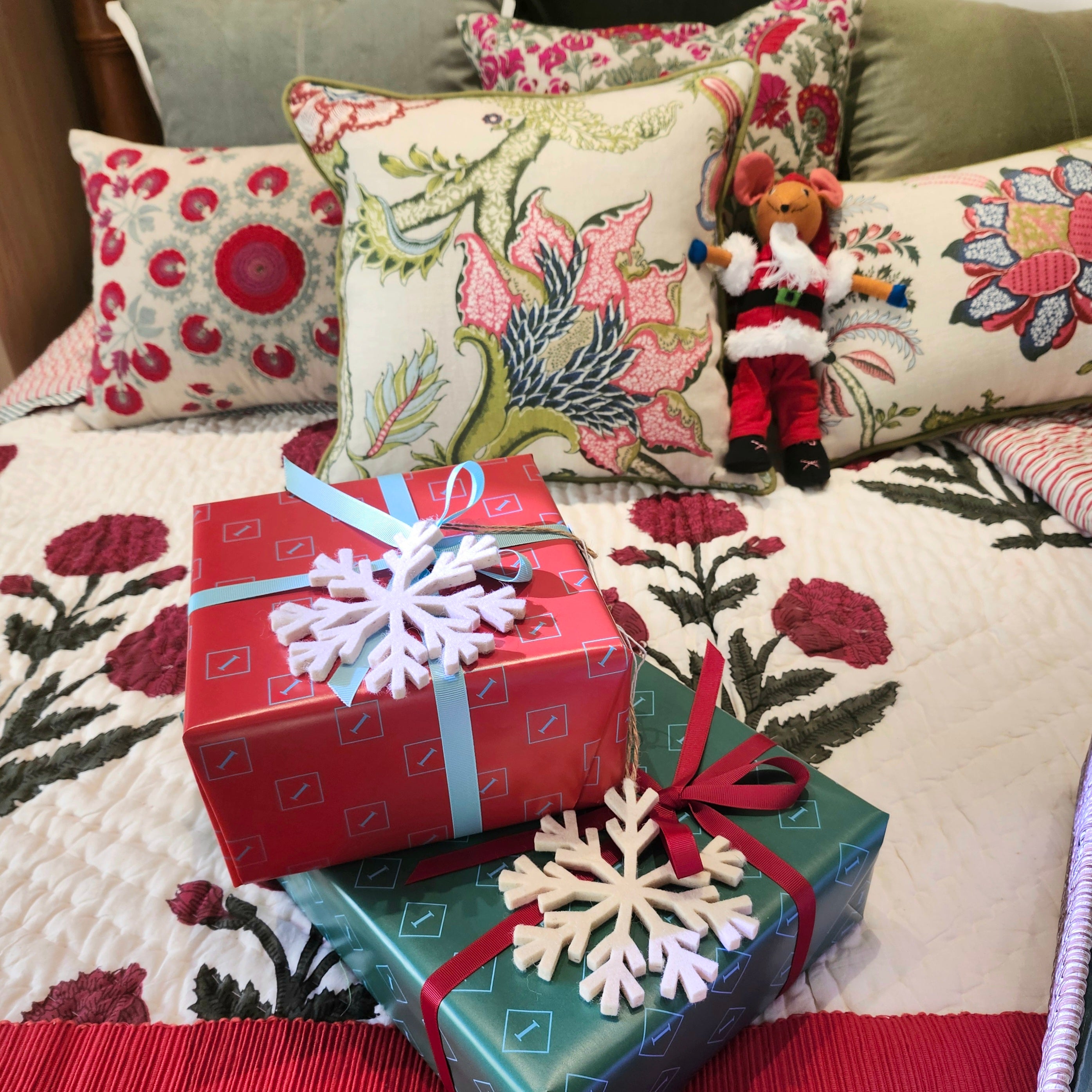 Seraphine linen cushion cover in a tree-of-life print with green piping