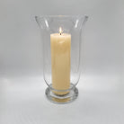 Glass vase or hurricane lamp with a pillar candle