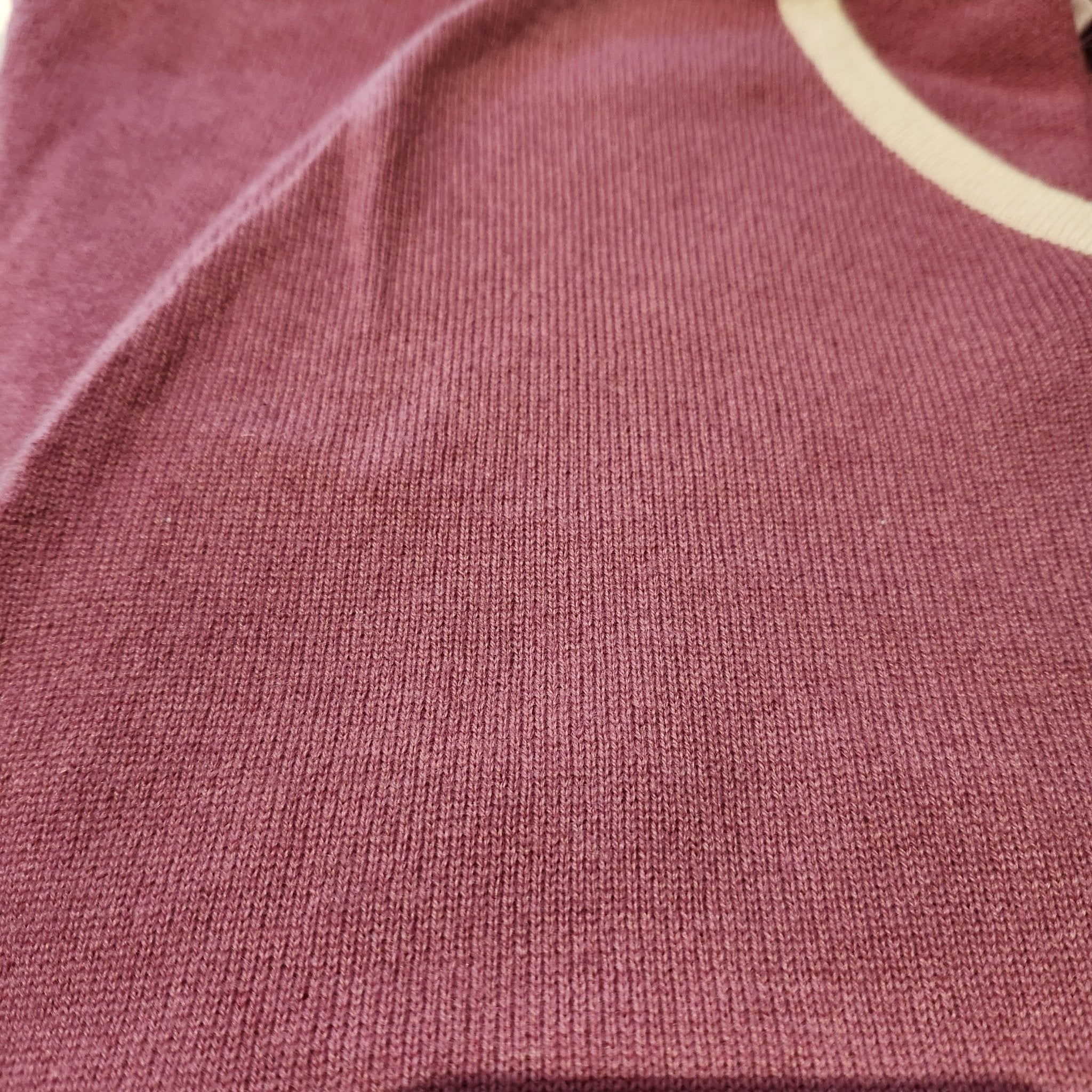 Pure cashmere children's poncho in a rose pink shade, made for the 4 to 6 years age group