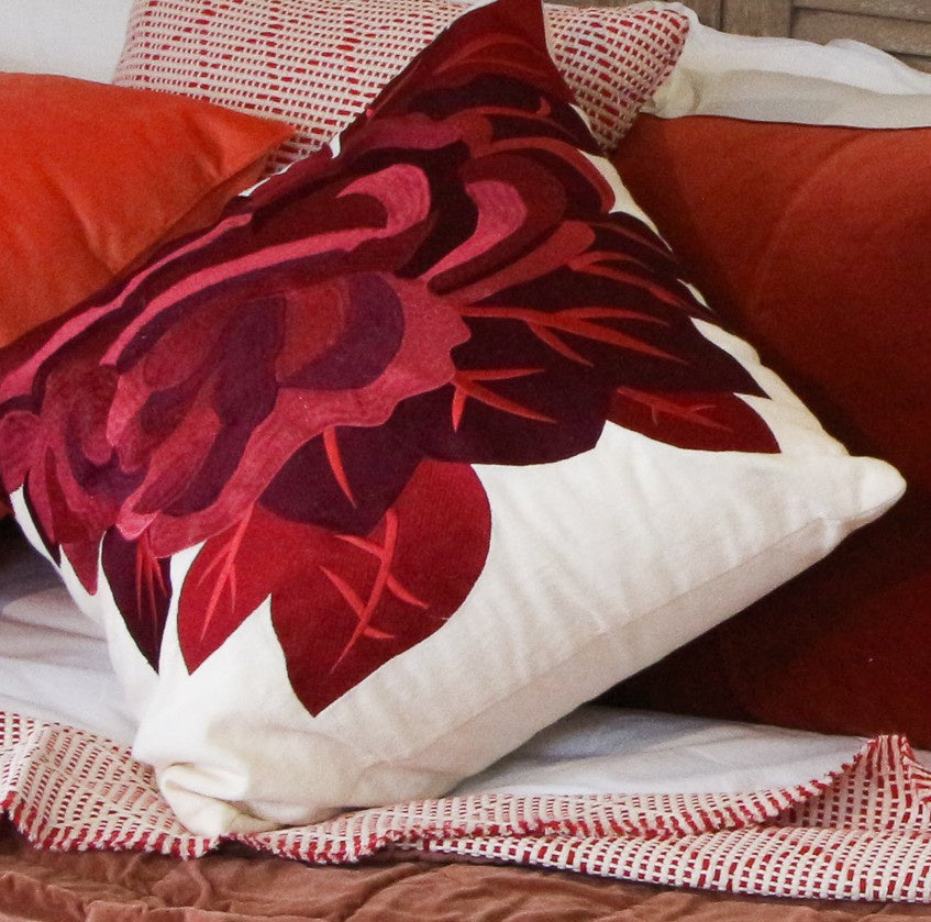 Red rose embroidered cushion on cream background by Ceannis, 50 x 50 cm