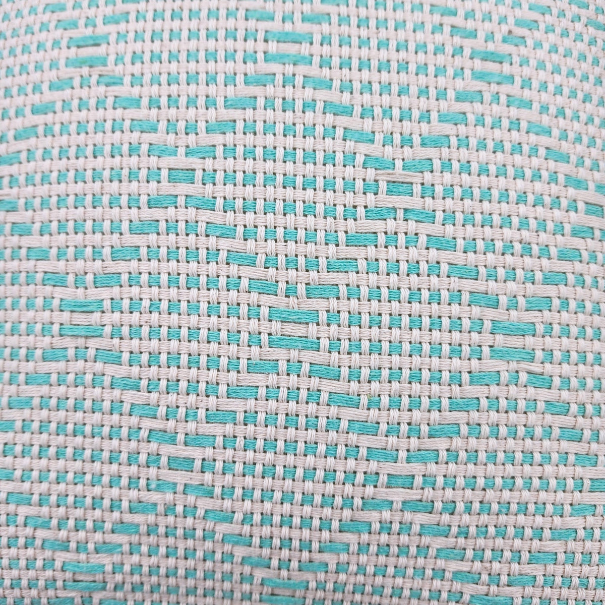 Close up of Portuguese mosaic recycled cotton throw in mint