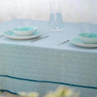 Recycled cotton tablecloth in blue, styled on a table, made in Portugal