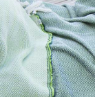 Reversible cotton throw in forest and lime, 150 x 180 cm