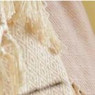 Reversible cotton throw in rose and natural, 150 x 180 cm