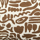 Nomad cushion cover, brown tribal print on cream, cotton linen blend, styled