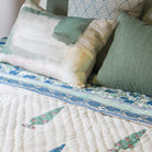 Thea cushion cover with an abstract print in cream and green