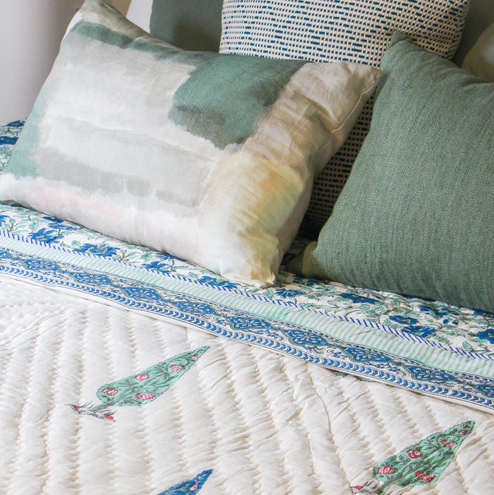Thea cushion cover with an abstract print in cream and green
