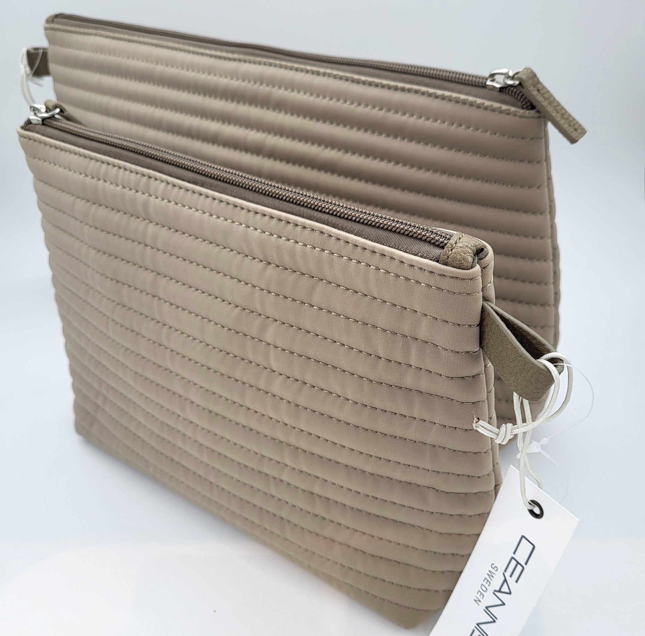 Soft quilted stripe cosmetic bag in taupe with a leather trim