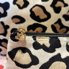 Leopard-print cosmetic bag with a paw charm zip