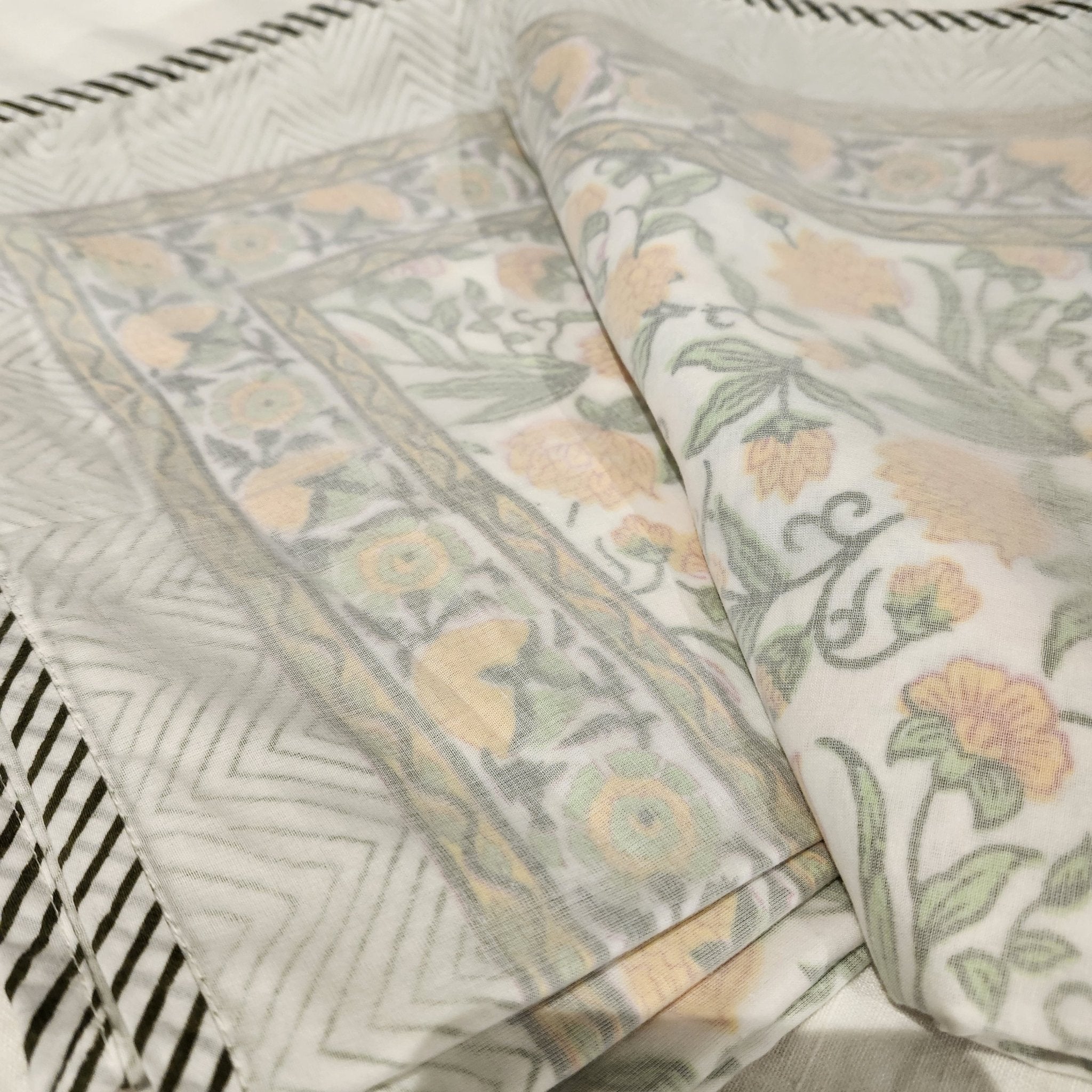 Single block-print cotton dohar blanket with a yellow flowers print, 150 by 225 cm, machine washable