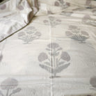 A block print dohar with a red poppy design