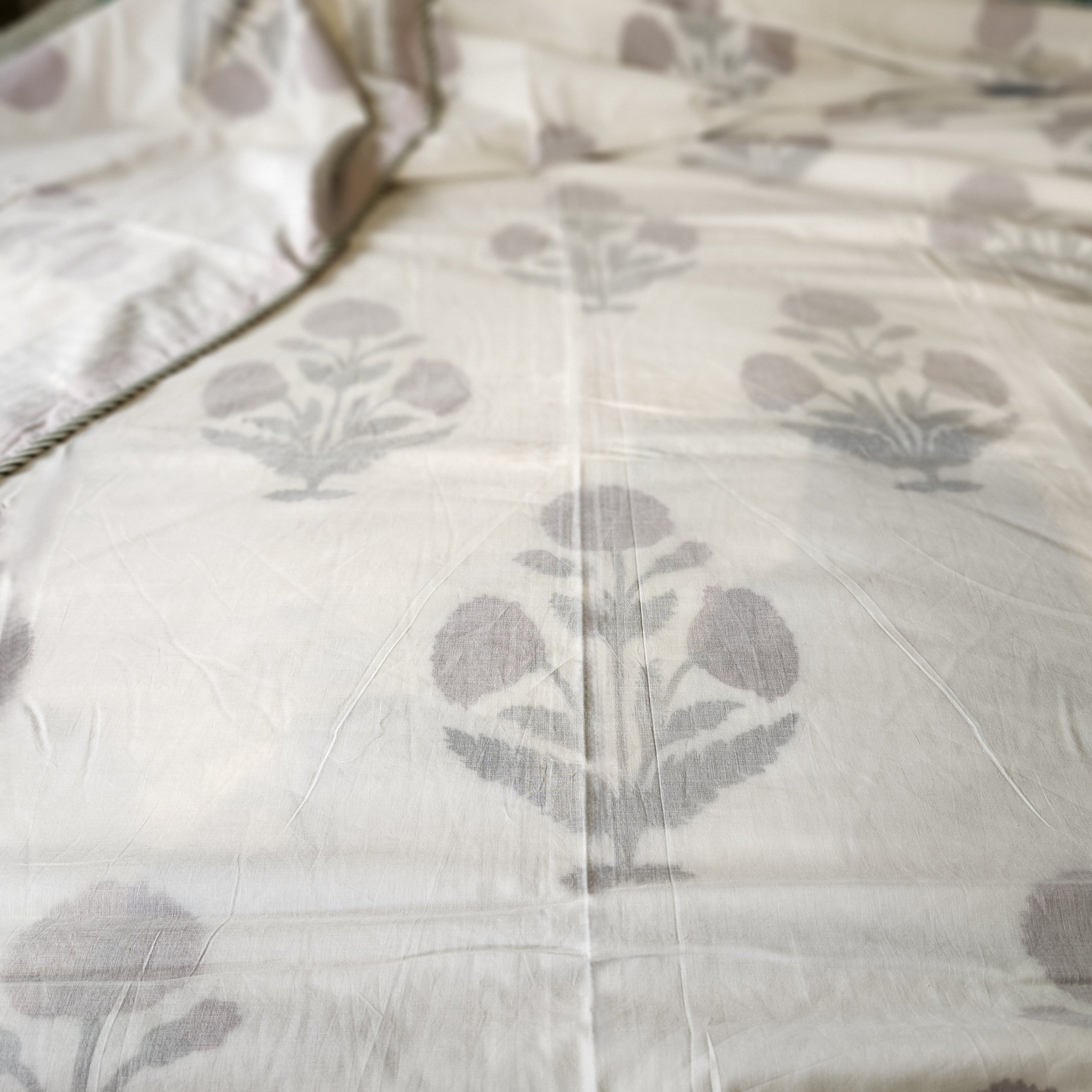 A block print dohar with a red poppy design