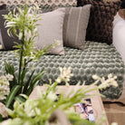 Green Egg Velvet Throw by Ceannis, 130 x 170 cm, draped to show eggshell pattern detail