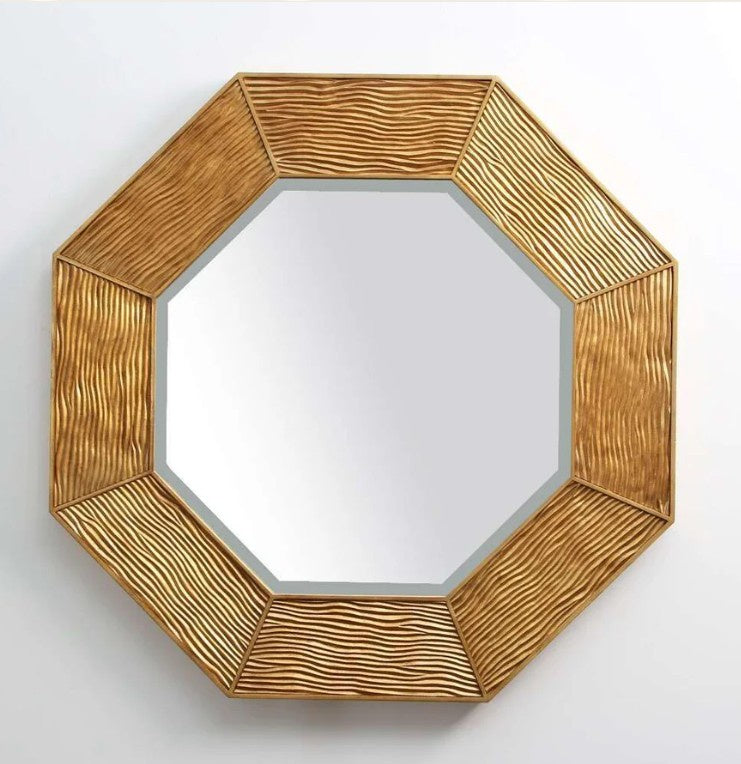 Lennox octagonal wall mirror in antique gold leaf with a carved ripple-effect frame