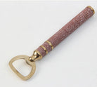Faux shagreen bottle opener in coral by Forwood Design, brass-plated stainless steel with textured handle