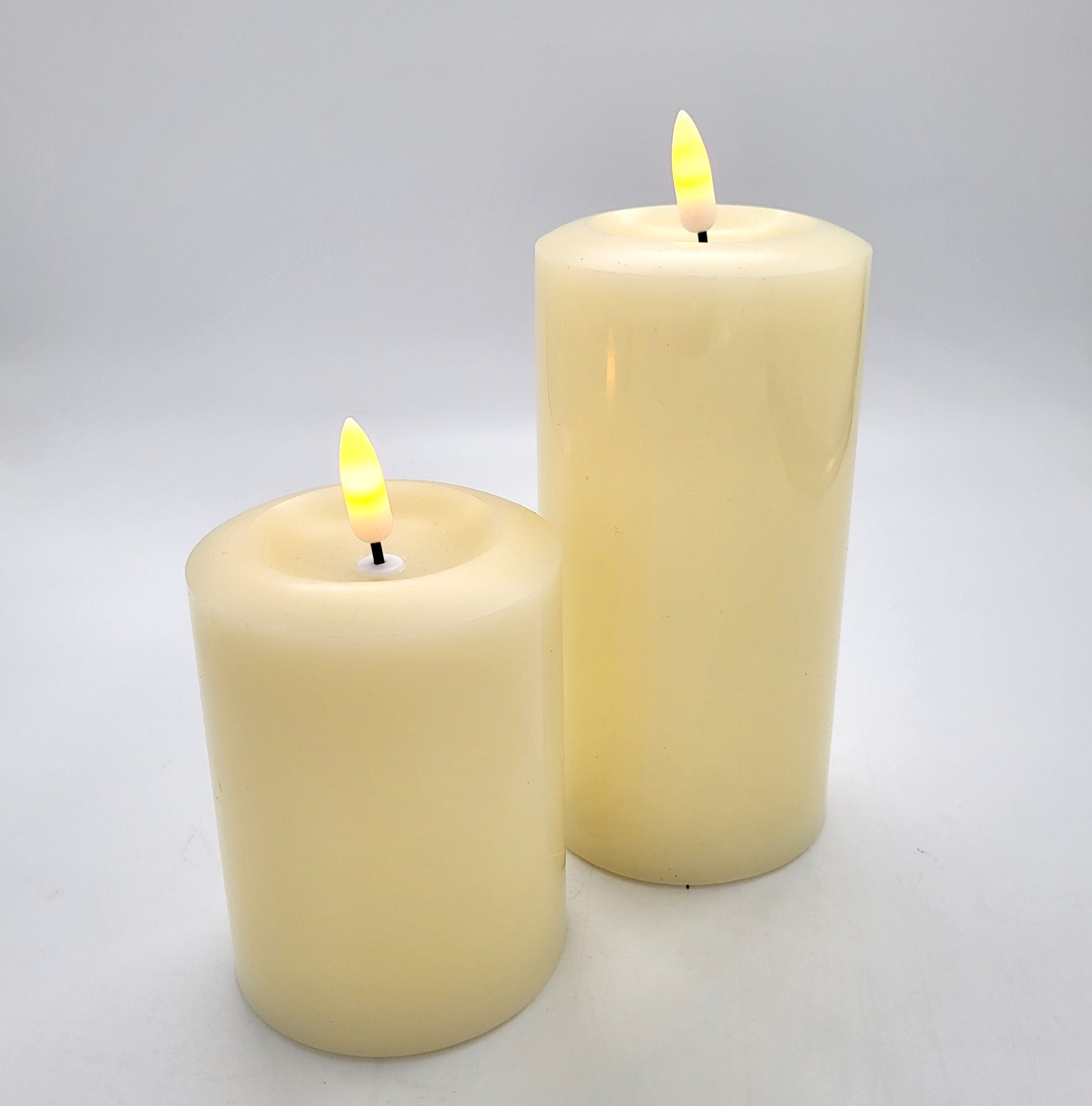 Flameless ivory pillar candles in three sizes, realistic battery-operated candles