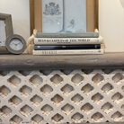 Dove grey teak console table with trellis front, styled