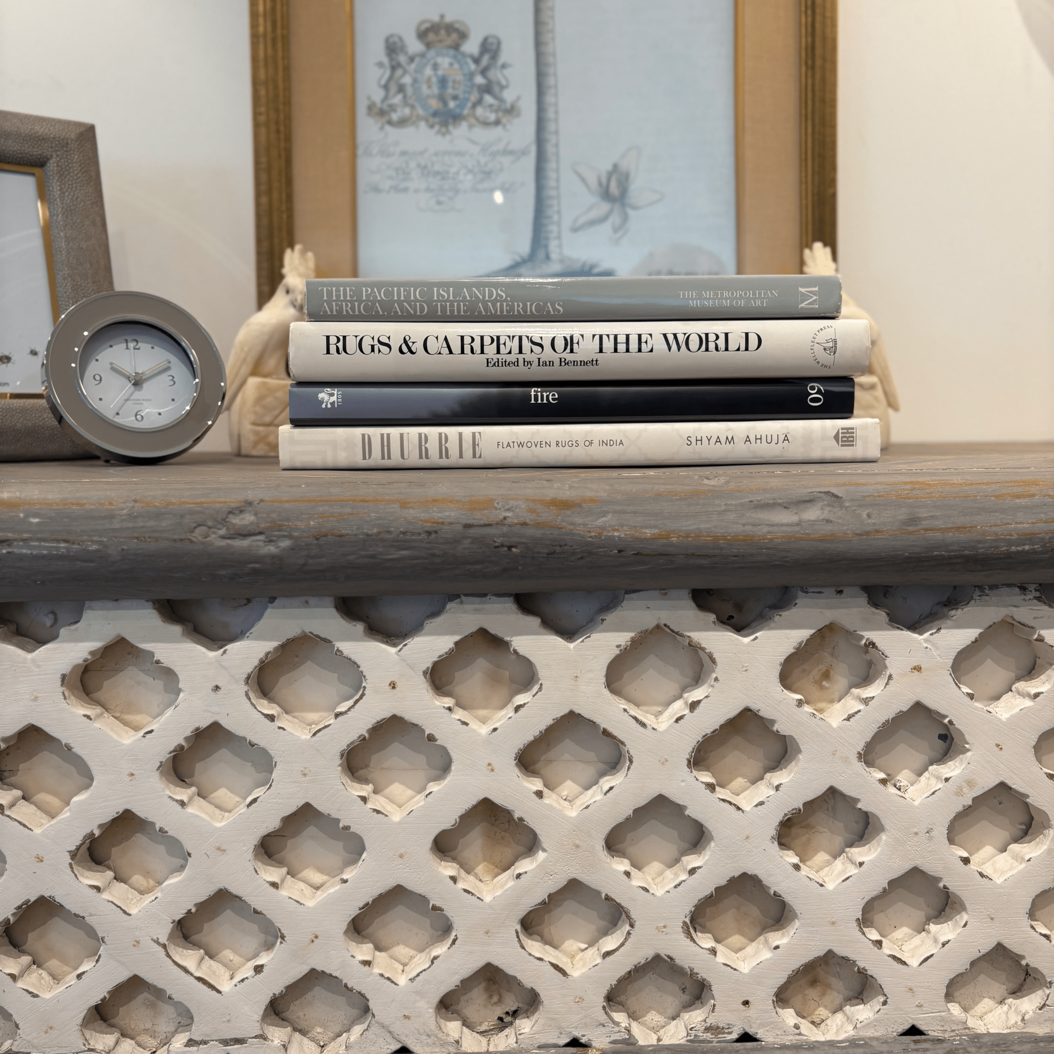 Dove grey teak console table with trellis front, styled