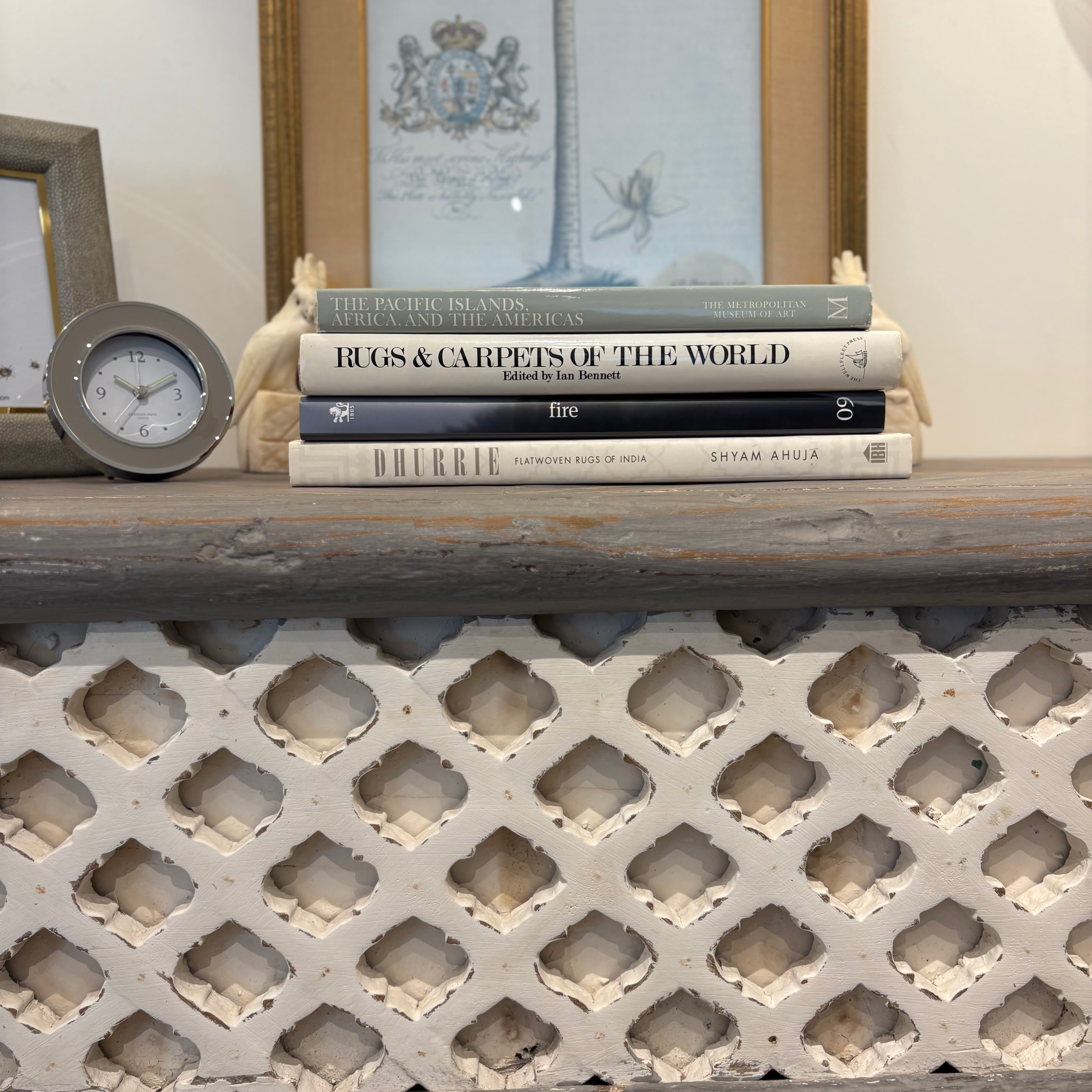 Dove grey teak console table with trellis front, styled