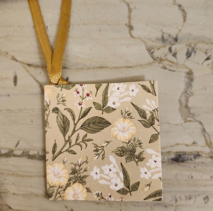Garden design printed card gift tag, 7.5cm square, tied with a gold ribbon, sold in assorted styles.