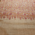 Hand-embroidered natural pashmina shawl, floral border, draped