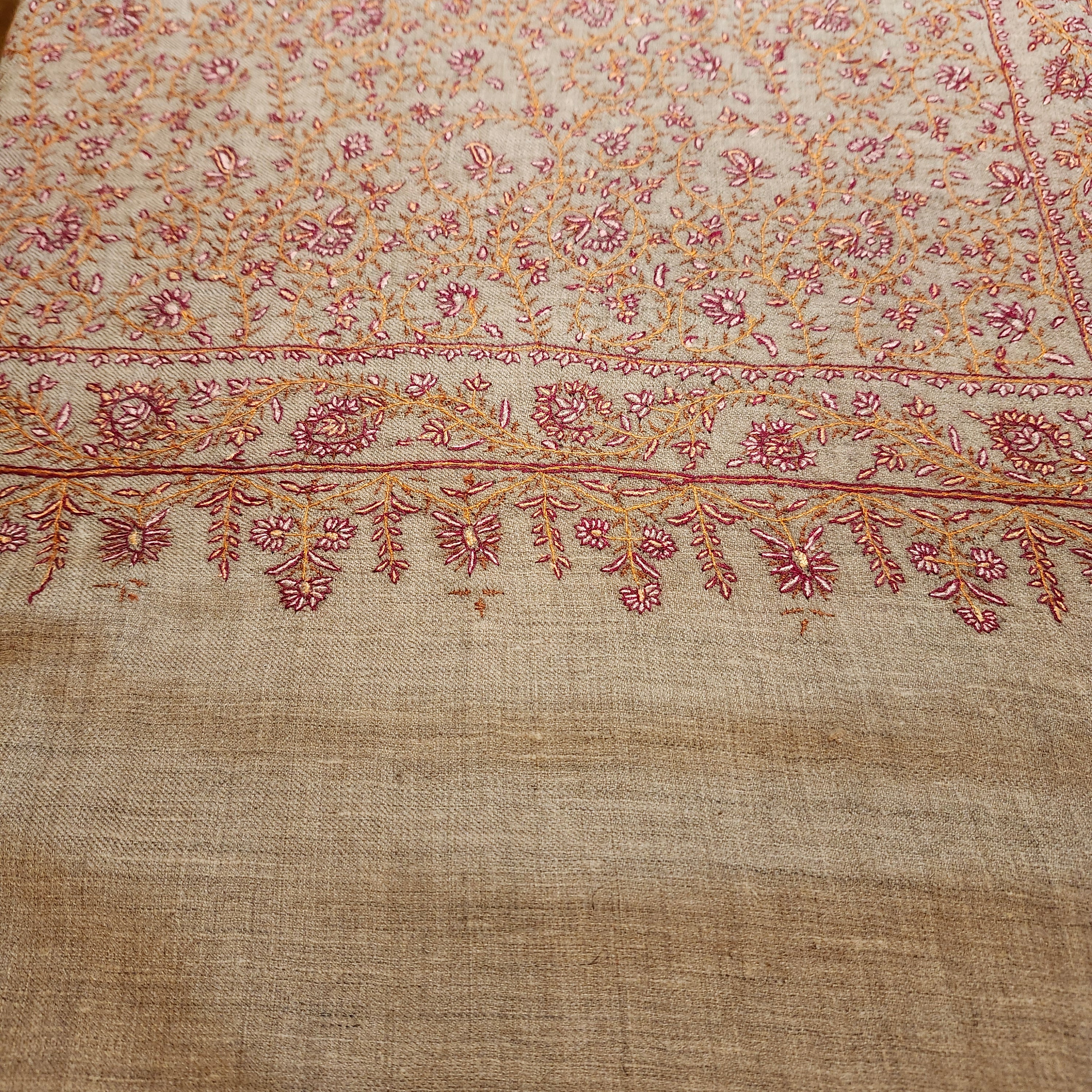 Hand-embroidered natural pashmina shawl, floral border, draped