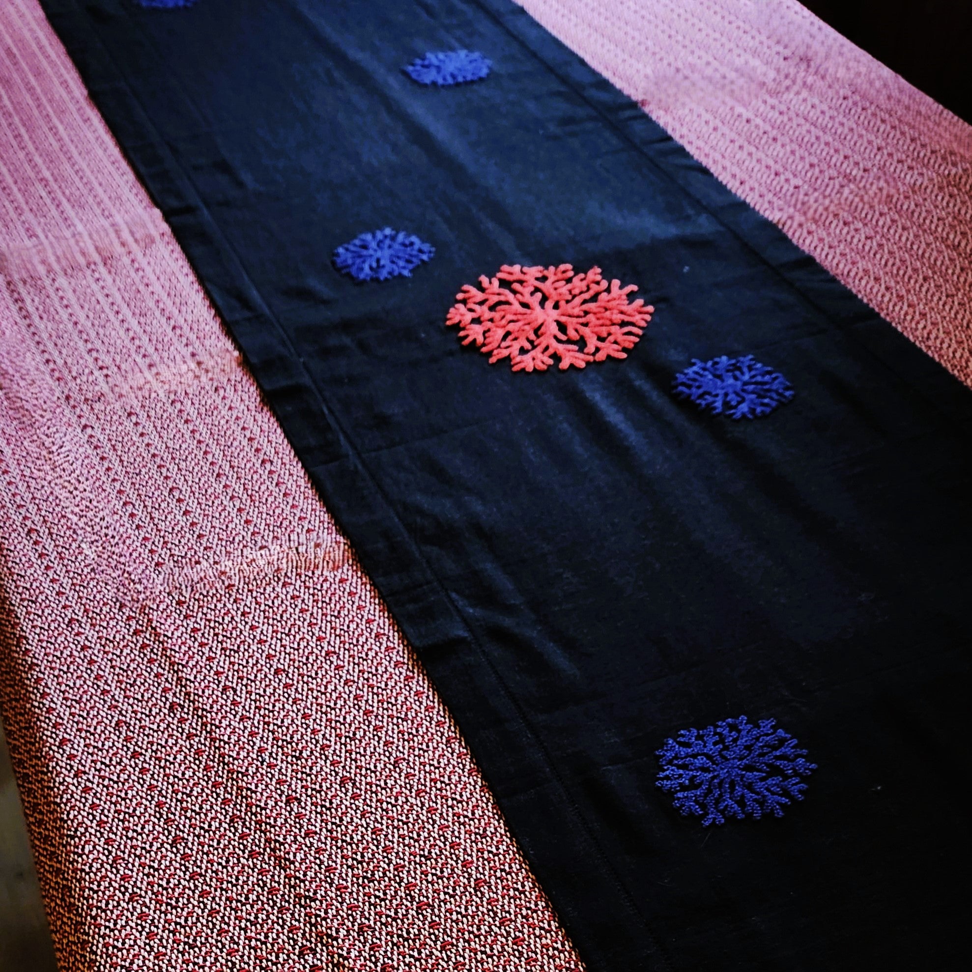 Coral and blue coral motif on black linen runner, hand embroidered, detail view