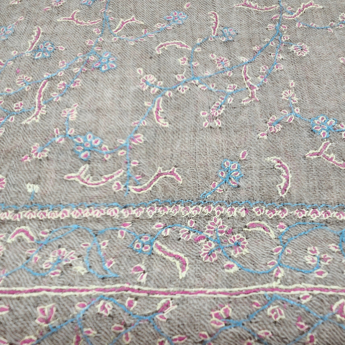 Alternative view of the baby blue hand-embroidered pashmina shawl, showing the delicate floral pattern.