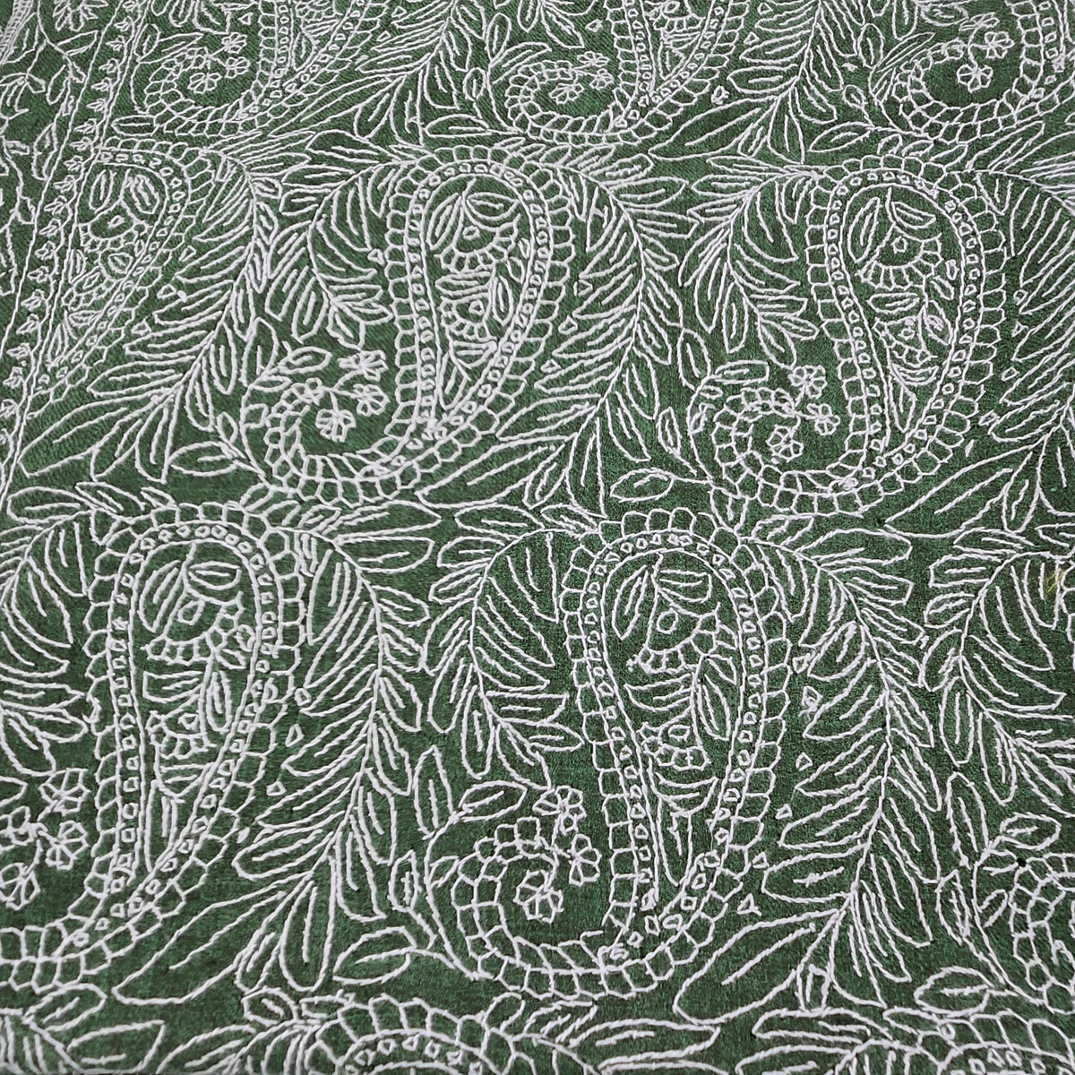 Alternative view of the green pashmina shawl, showing the hand-embroidered white paisley pattern in full.