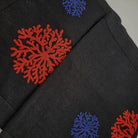 Hand embroidered linen table runner, coral motif in coral and blue on black, 38 x 200 cm