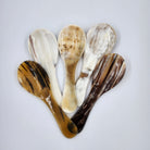 A group of natural horn serving or rice spoons