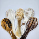 A group of natural horn serving spoons