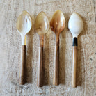 Four horn and wood small dessert or tea spoons