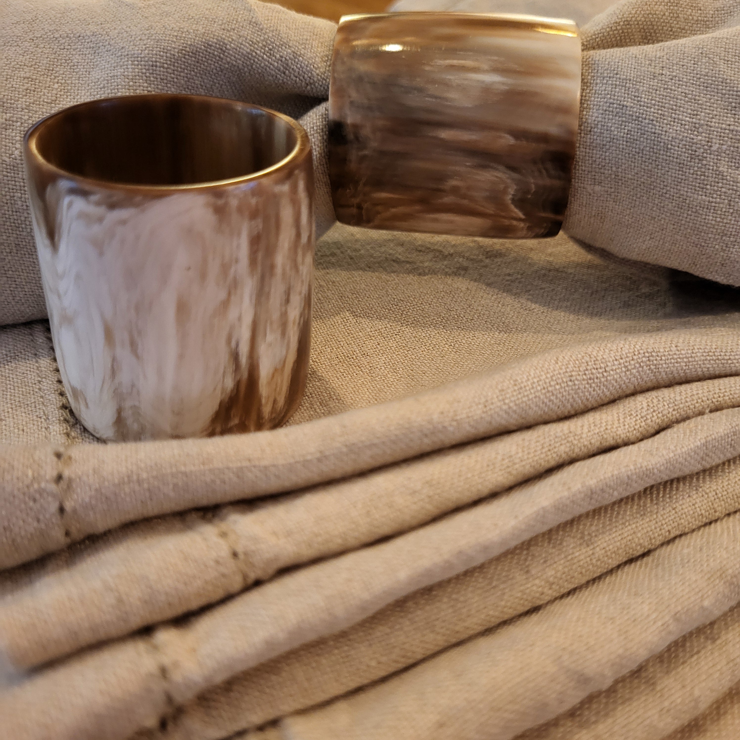 Carved horn napkin rings, set of six, natural variations