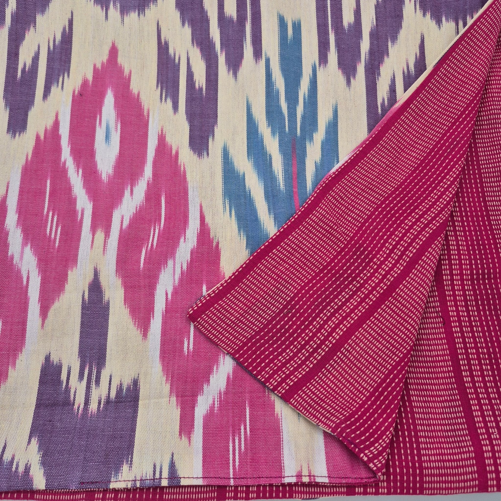 Reversible table runner in 3 sizes. Ikat on one side, woven stripes on the other