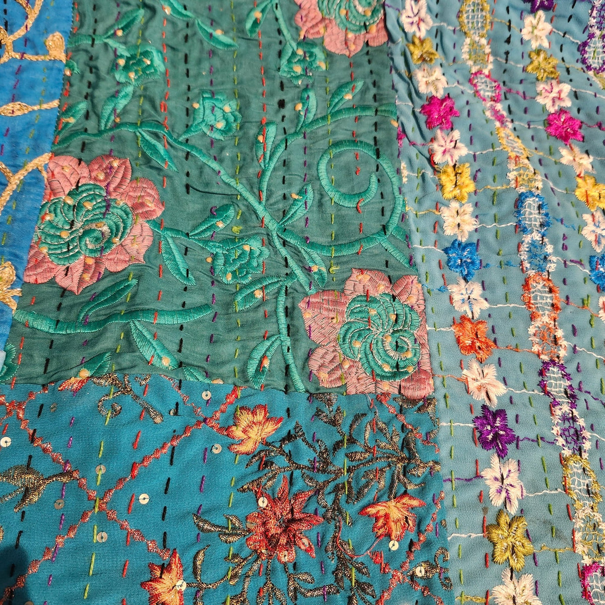 Mauve reverse of the blue kantha patchwork single quilt, with hand stitching in two colours across the cotton, dry clean only