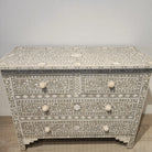 Taupe bone inlay chest with four drawers and carved bone knobs