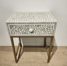 Bone inlay side table in taupe with a leaf design and metal frame
